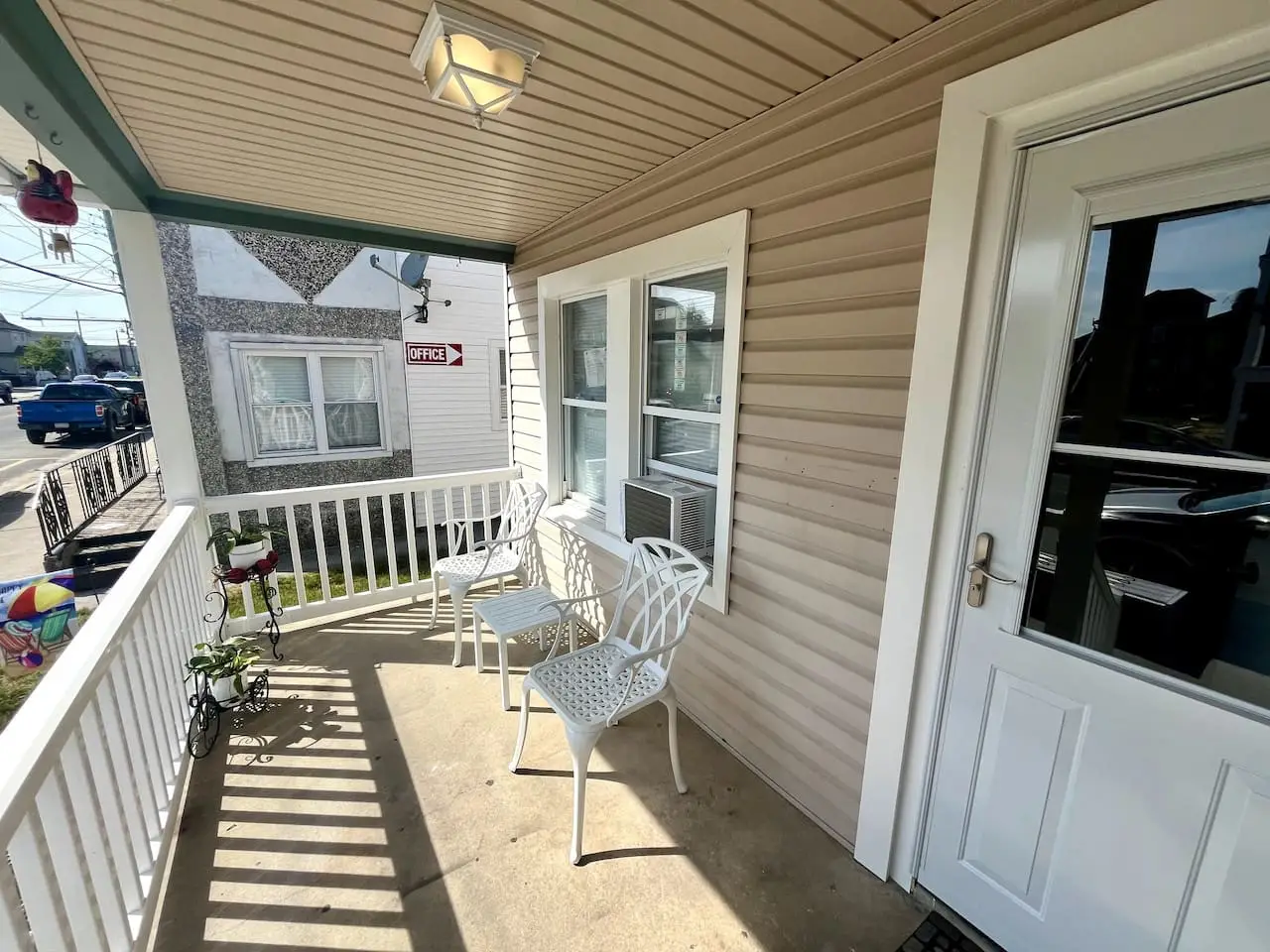 Covered front porch with seating at 143 East Spencer Avenue