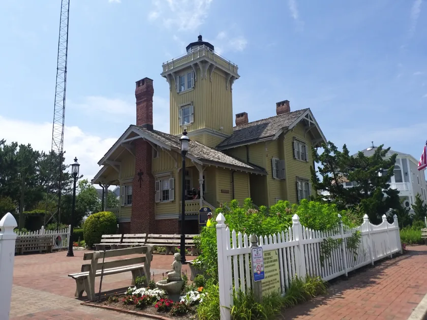 Hereford Inlet Lighthouse behind its white garden fence